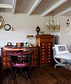 Desk and chair with tallboy in country cottage