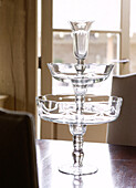 Glass cake stand on wooden tabletop