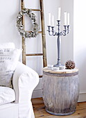 Bamboo ladder with candlestick on side table home in City of Bath Somerset, England, UK