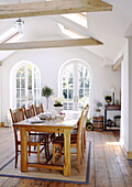 Arched patio doors in dining room with beamed ceiling in City of Bath Somerset, England, UK