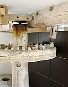 Old mechanism in renovated Cotswolds mill house England UK