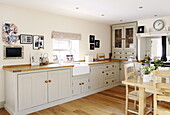 Fitted units and wooden worktop in contemporary family kitchen Durham England UK
