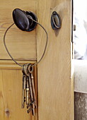 Old metal keys hang on door handle Gateshead Tyne and Wear England UK