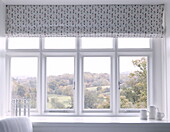 View through window with roman blinds to Tunbridge Wells countryside Kent England UK