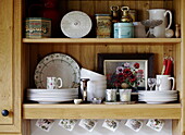 Kitchenware and storage tins on wooden dresser in Hexham country house Northumberland England UK
