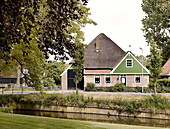 Detached house on canal side in Abbekerk is a town in the Dutch province of North Holland municipality of Medemblik