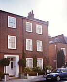 Three storey brick exterior of London townhouse UK