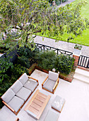 Patio seating in back garden of classic London home, England, UK