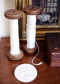 Vintage spools with a cameo and artwork in Warwickshire home, England, UK