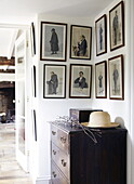 Framed prints in entrance hall to Oxfordshire home, England, UK
