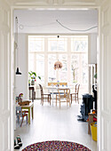 View through playroom to dining area in contemporary apartment, Amsterdam, Netherlands