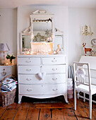 White painted chest of drawers in bedroom of Derbyshire farmhouse England UK