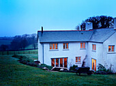White painted house in rural Devon countryside UK