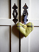 Heart shaped ornament with lock and key in Surrey farmhouse England UK