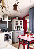 Red and white schoolhouse kitchen conversion Brittany France