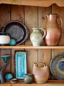 Glazed ceramic on wooden shelf in Derbyshire farmhouse England UK