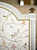 Embroidered screen in bedroom of traditional country house Welsh borders UK