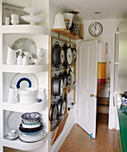 Chinaware and saucepan storage in Notting Hill kitchen West London UK