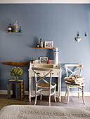 Cream desk and chair with crate in light blue bedroom Brittany guesthouse France