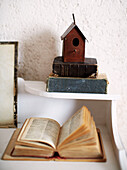Birdhouse and vintage books in Brittany farmhouse France
