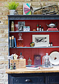 Tuba on upcycled kitchen dresser in Kent home England UK