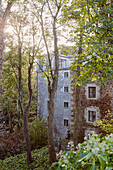 Five storey exterior of 19th Century Grain Mill conversion in the Scottish Borders, UK