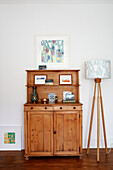 Wooden sideboard and lamp in Birmingham home England UK