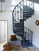 Wrought iron spiral staircase in entrance hallway of County Durham home England UK