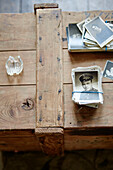 Black and white photographs on wooden crate in Country Durham home, North East England