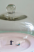 Figurine of man and bird under glass cover in Country Durham home, North East England