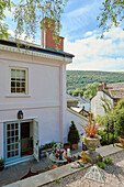 Elevated view of open back door and patio of 19th century Georgian townhouse in Talgarth, Mid Wales, UK