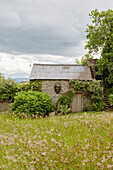 Corrugated metal roof of stone barn in Herefordshire countryside, UK