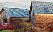 Modern barn conversions in winter garden in Worcestershire, England, UK