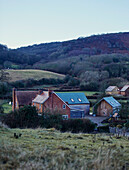 Rural Worcestershire farmhouse on hillside in winter, England, UK