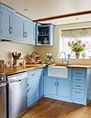 Light blue fitted kitchen in Berkshire cottage, England, UK