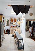 Black fabric on laundry airer in utility room of Oxfordshire farmhouse, UK