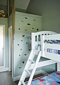 Bunkbed and climbing wall in boy's room of Northumberland farmhouse, UK