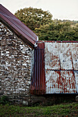 Corrugated metal roof on old stone barn in Radnorshire-Herefordshire border