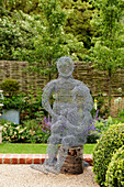 Wire mesh sculpture in Cotswolds garden, UK