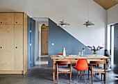 Pendant lights above table with chairs and wooden storage in Sligo newbuild, Ireland