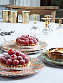 Tabletop with raspberry tarts