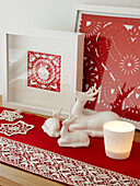 Red and white Christmas ornaments in Polish home