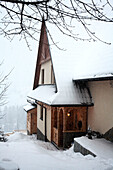 Snow covered mountain chalet in Poland