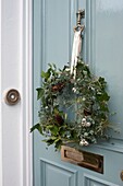 Christmas wreath hanging on door