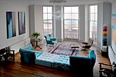 Dramatic seaviews from large bay window of living room with large daybed St Leonards on Sea, East Sussex, UK