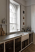 Arched window above butler sink in Somerset kitchen UK