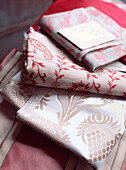 Samples of decorative red and white printed cotton fabrics 