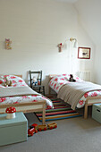 Train set and twin beds in child's room of Canterbury home England UK