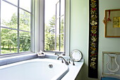 Open window above bath in Massachusetts home, New England, USA
