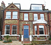 Semi-detached brick three-storey house in Broadstairs, Kent, England, UK